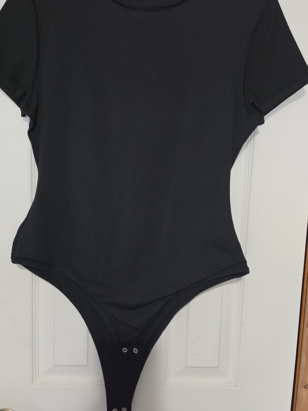Womens Black Short-Sleeve One-Piece Bodysuit